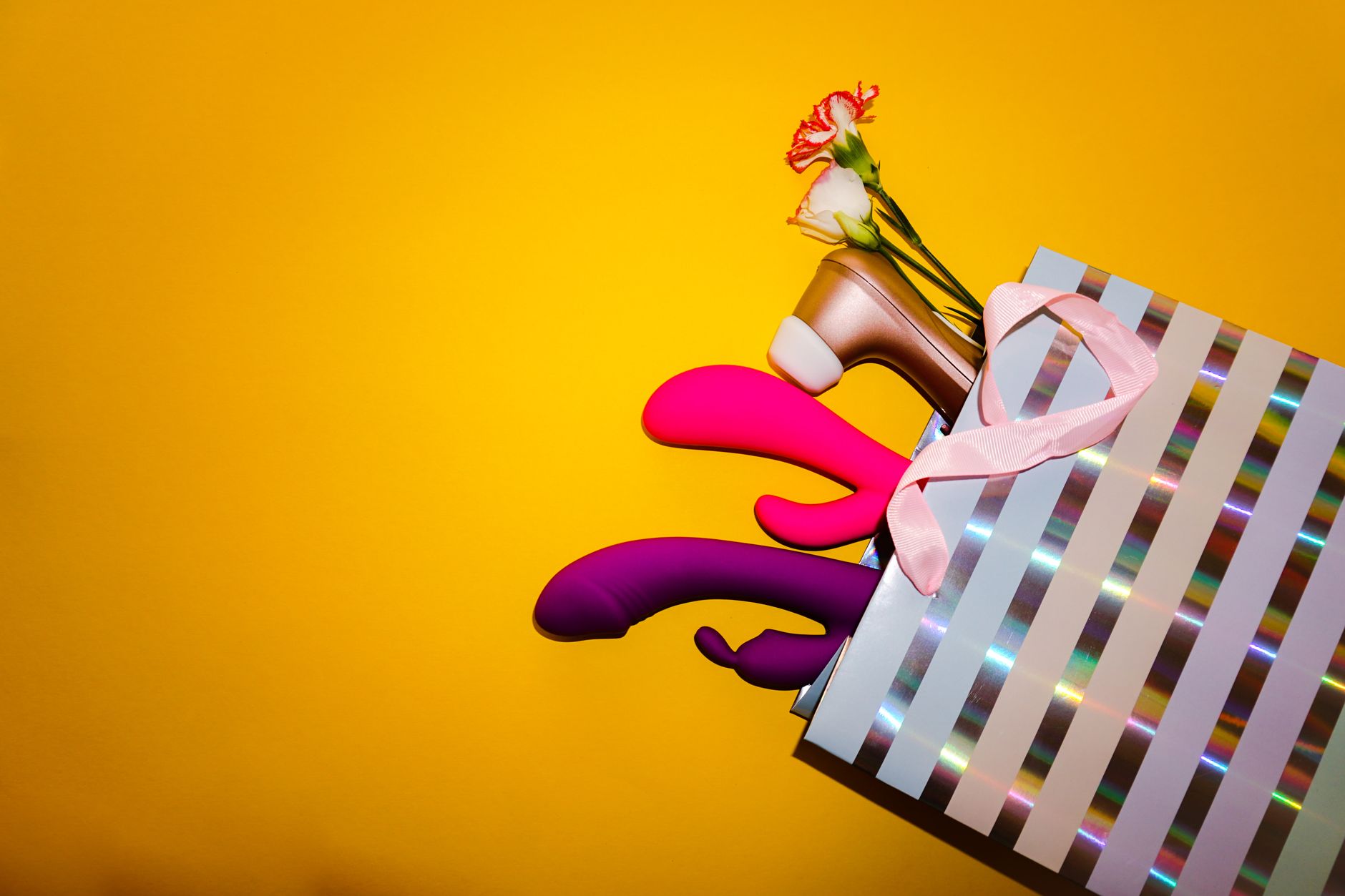 Colorful vibrators with flowers displayed in a bright, inviting arrangement